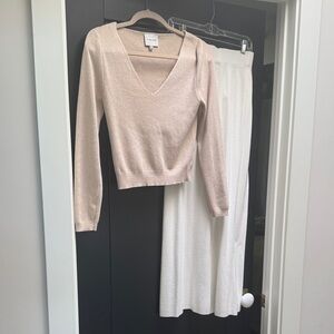 This is a two piece knit sweater outfit pants and top